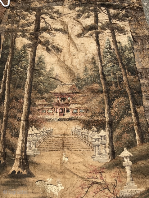 Japanese Embroidered Wall Hanging
Silk hand embroidery of pine forest and pagoda with two deer in foreground on hand-woven with supplemental weft background. 5” hand-woven geometric border. Orange brown brocaded floral and vine  ...