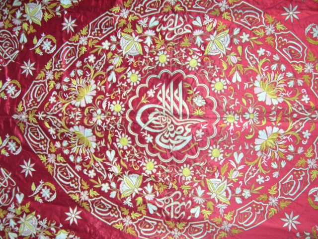 LARGE TURKISH EMBROIDERED WALL HANGING 

Showing sultan's Turga (insignia) in center and with additional calligraphy.
Chain stitch embroidery (tambour work?) using both silk floss and metallic embroidery threads on scarlet silk ground. Fully  ...