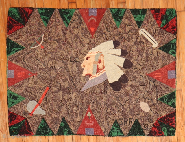 DAted American Hooked rug.  Native american Cheif in center with lovely highlights.  3'x4'..  Dated 1956?               