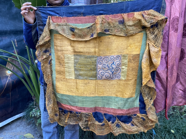 Chinese silks joined to make a ritual Tibetan mandala offering canopy 
to hang directly over the mandala
Petit point embroidery and a woven kalachakra symbol surrounded by Ming period 
golden silk with a  ...