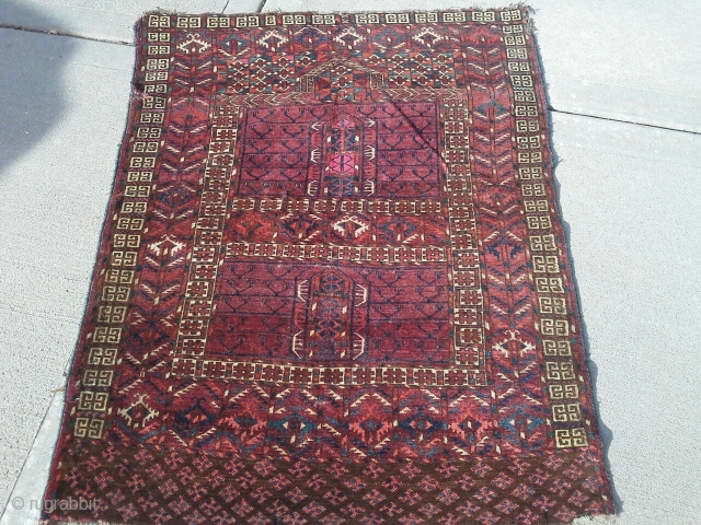 Late 19th century Tekke 43"x 57". Pile is good, there are very minor moth damage in the field. See pix for other damage. Dyes look natural, asymmetrical knot.
     