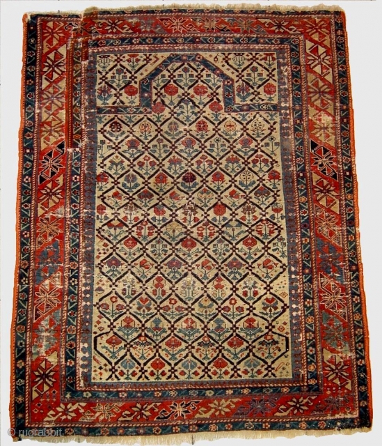 Early caucasian prayer rug, wth silk wefts and a few knots of silk highlights in the field                