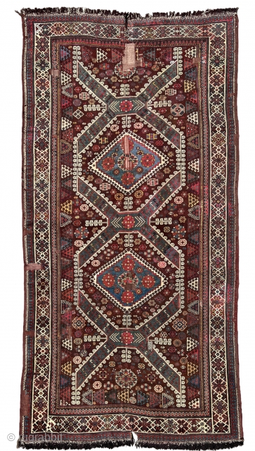 This rare carpet with a nomadic-looking pattern, brown-red ground and border drawing is, according to structure and colours, probably a very old Qashqa’i work. The carpet was made at a time when  ...