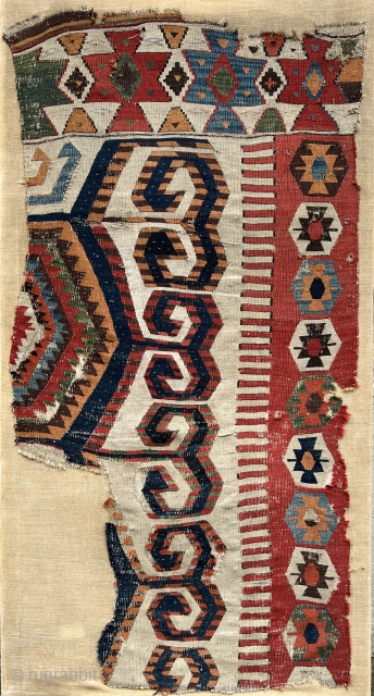 This impressive white-ground kilim fragment is a weaving from the Aksaray area in central Anatolia. The hexagons with large double hooks are very broadly drawn. The impact of the design and colors  ...