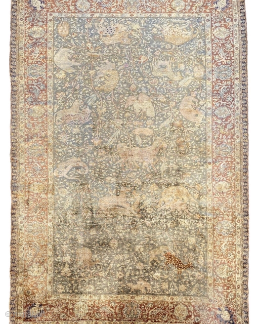 Animal Hunting Scene Kayseri Carpet, This finely woven Kayseri silk carpet displays in the expansive central field on a light pistachio-coloured ground, a painterly approach with images of animals in combat against  ...