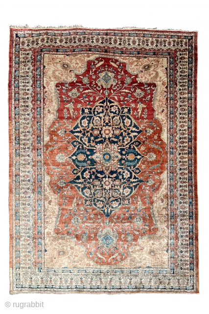 This elegant silk rug from the Tabriz workshops in pastel shades shows a central medallion design and a wide border section. High-quality silk carpets such as this finely and carefully executed example  ...