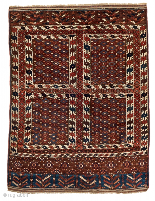 A Yomut tent door rug displaying the hatchlu cross design on a red-brown field. The harmonious and confident proportions of the design and the quality of the colours allow this Yomut ensi  ...