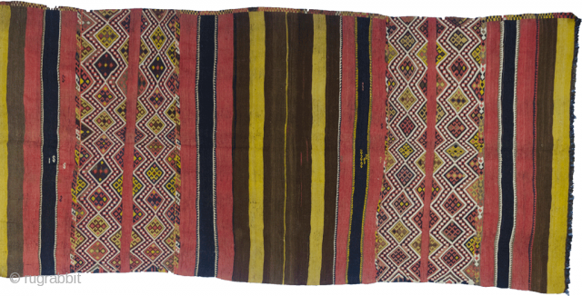 Magnificent antique Kordi kilim. Wonderful natural dyes and tribal designs with randomly placed “S” design. This is a khorjin that has been opened up and can also be used as a very  ...