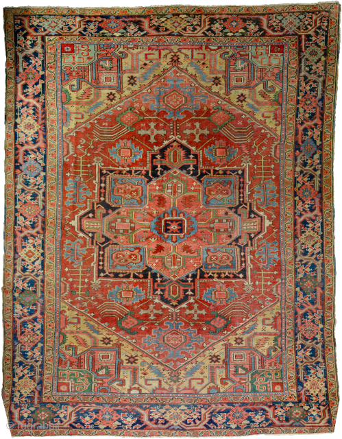 Antique Bakhshayesh Carpet 380x294cm, late 19th Century. Minor repairs are expertly done. The rich red ground colour contains a large red medallion. The motifs around the medallion have unusual features like the  ...