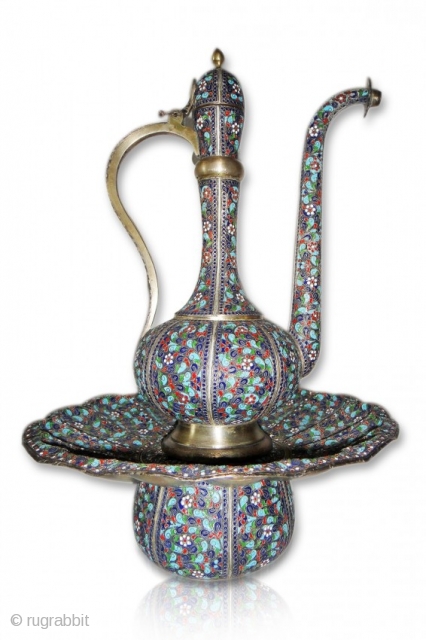 A PERSIAN ENAMELLED SILVER EWER AND BASIN

A Extremly beautiful rare and very important persian enamelled silver ewer and basin made by Mohammad Ali Yousufi marked and stamped his name . 
19th century  ...