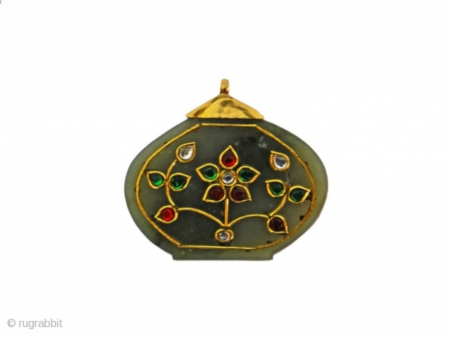 A MUGHAL GEM-SET JADE PENDANT INDIAN 18TH CENTURY

of cartouche form, inlaid in gold kundan and set with stones forming a floral spray with buds suspension loop . Meaurment : high " 5.4  ...