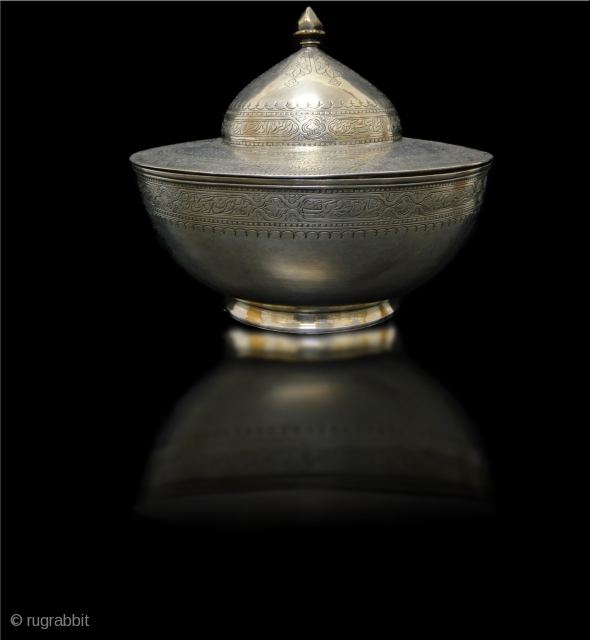 A Persian - Arabic beautiful silver sweet box engraved arabic & persian words . Date 19th Century mentioned around rim of the box in arabic .



       