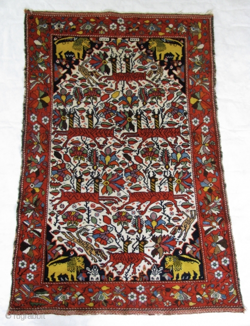 Doppelgänger Galloping Gazelles 3' 1" x 4' 5" West Persian Village Rug.  Single white cotton wefting is intertwined with brown or red wool strands.  The red . . . and  ...