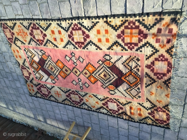 Bessarabian handwoven kilim from the early 1900s. Unique pink field and multiple size diamond designs in the field surrounded by a large primary border also having diamond designs. It shows age, but  ...