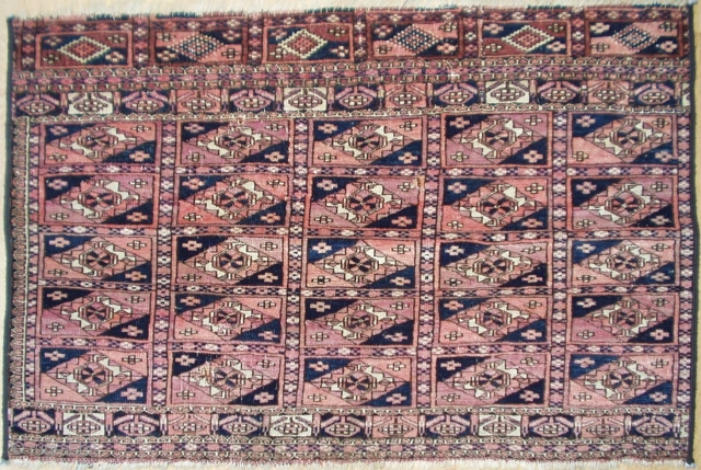 A collectors semi-antique Turkoman mafresh (bag face), 3'x2' approx. Paneled gulls to the field and borders are done in soft rust, wine and midnight blue colors. Turkmenistan, 2nd quarter 20th century.  