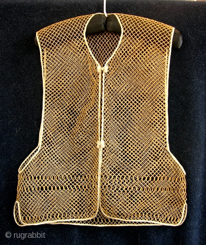 Antique Chinese Bamboo Vest

Bamboo Vests were used as undershirts under silk garments. They served the duel purpose of allowing some air circulation and protected the silk garments from body oils. These vest  ...