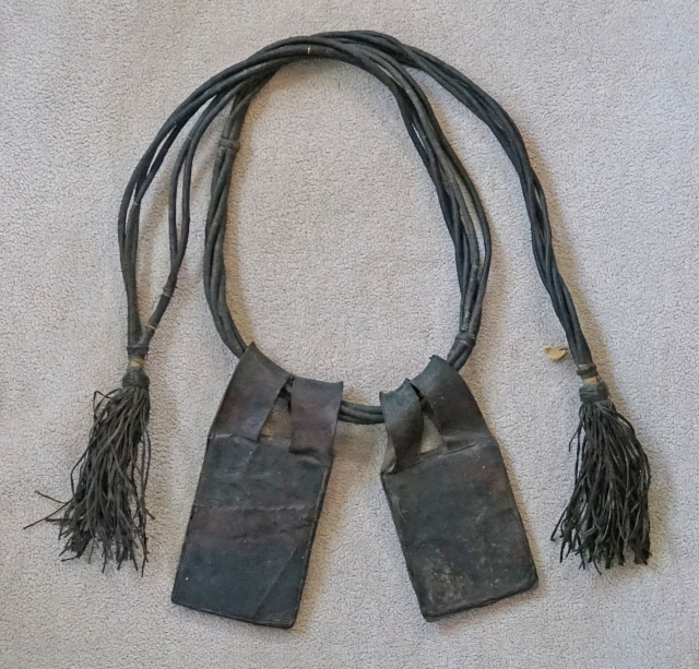 This Antique leather Tuareg belt with hanging talismans, is from the African region of Timbuktu, Mali. Including the fringe, the total length is roughly 46 inches. The leather talisman are flat. They  ...