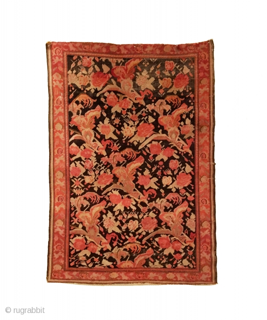 Antique Caucasian Karabagh Rug.  Circa Antique.  Flowers on a dark brown field. Repaired slits in right border as shown. Slight loss to top.  Even wear.  5 colors.   ...