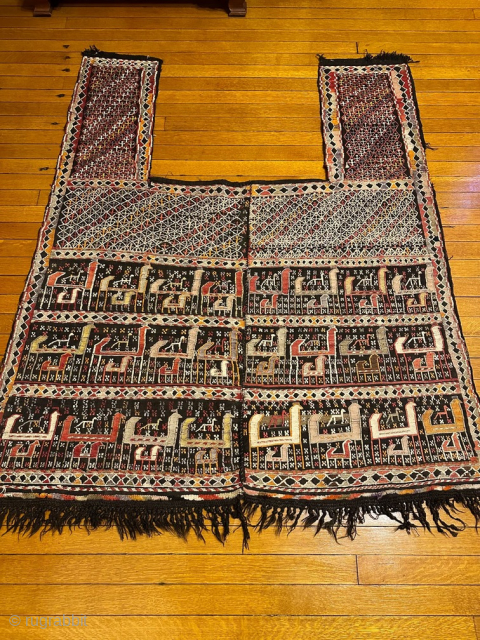 4’6” X 5’0” Shahsavan Soumak Horse Cover [SH-130]

Circa Antique. Three rows of three different animals. Flowing honeycomb lattice containing crosses. Woven in two panels joined in the center. Chocolate brown warps. Very  ...