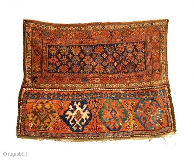 Antique Bakhtiari Large Saddlebag. 2nd Half 19th Century. Bag front. Mother goddess like figures nest between truly tribal, archaic gols. Rare weaving in both soumak and piled sections. Full pile lower panel.  ...