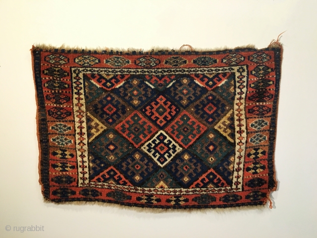 Jaf Kurd Bag face.  Circa Antique.  Four conjoined hooked motifs create center diamond surrounded by purple brown field.  Soft and thick pile.  Very good condition.  Old re-selvaged  ...