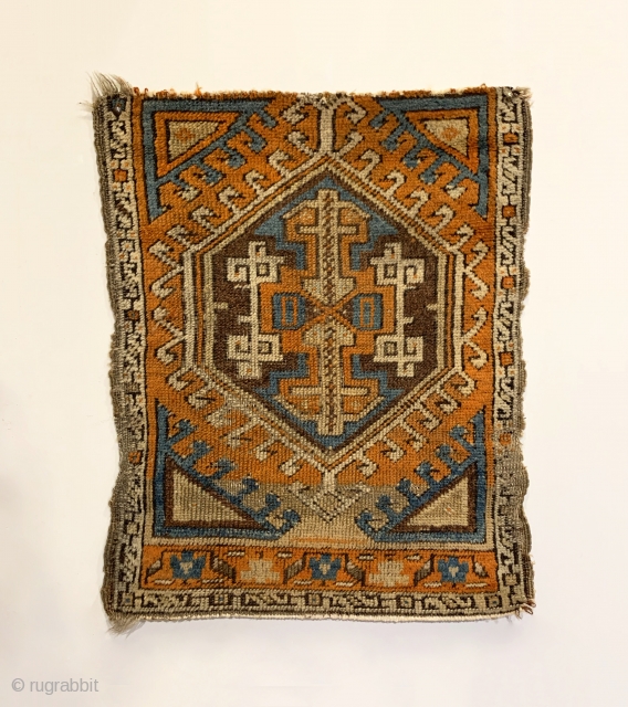 Early Yastik Fragment. Central Anatolia. 2nd Half 19th Century. Abrashed field with saturated colors including strong purple and turquoise. Compare the rendering of center medallion arrows and joined ivory hooks to plates  ...