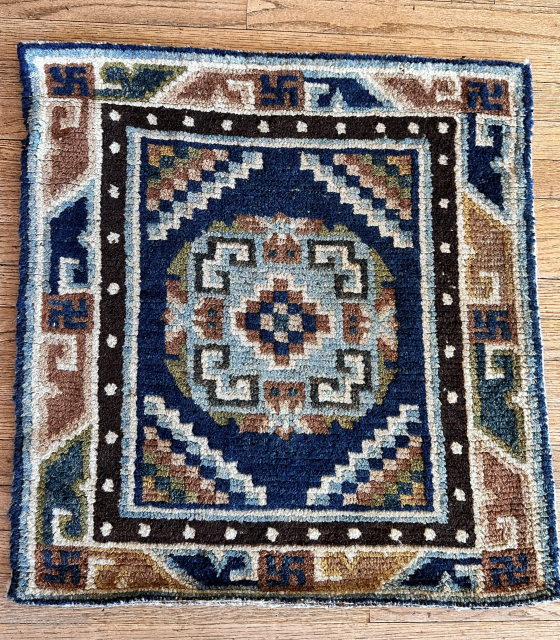 Small sitting mat with exceptional color. this example features an attractive and unusual foliated border
Ex- Robert Piccus Collection
Tibet
late 19th - early 20th Century

tmond@hotmail.com          