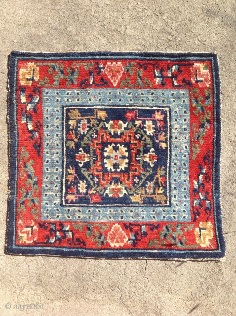 Small sitting carpet with great colour. The slightly crowded field is nicely complimented by the a light indigo Barley grain inner border. Beautifully drawn floral spandrels finish the outer border. Pile is  ...