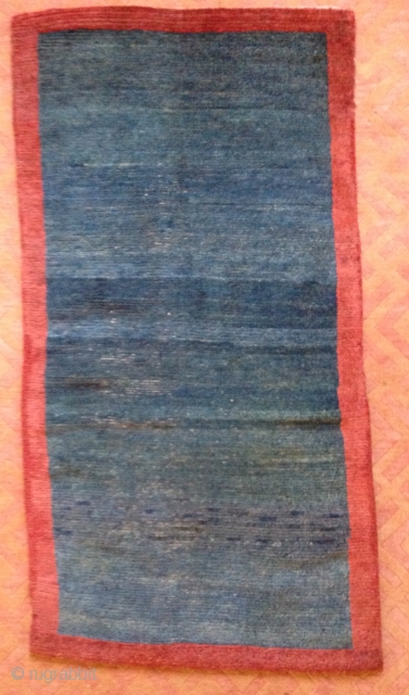 Khaden.
Open field green/indigo sleeping carpet. 
Field and border repairs. Some low pile
31 x 59 inches
19th Century
Tibet                 