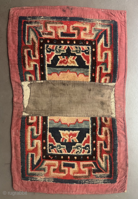 A somewhat smaller under saddle rug (Makden) from central Tibet. Probably from the first half of the 20th century. 
90 x 55 cm. No restorations. In as found condition. Inexpensive   