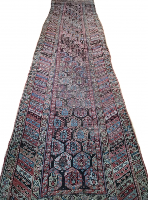 Antique Malayar Kurd runner from Northwest Persia ca.1900- 442cmx100/106cm stretched. This runner has been cut and shows traces of repairs. Suggestion, Use to make pillow cases or handbags. 

So old and still  ...