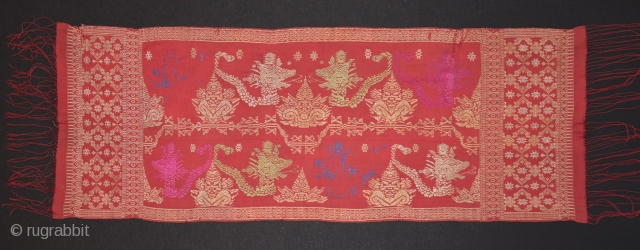 Balinese ceremonial cloth depicting heads of the demon Kalarau. Early to mid 20th c.  Songket (gold wrapped thread)- silk dyes, some embroidery erosion. 120x 40cm. www.tinatabone.com      