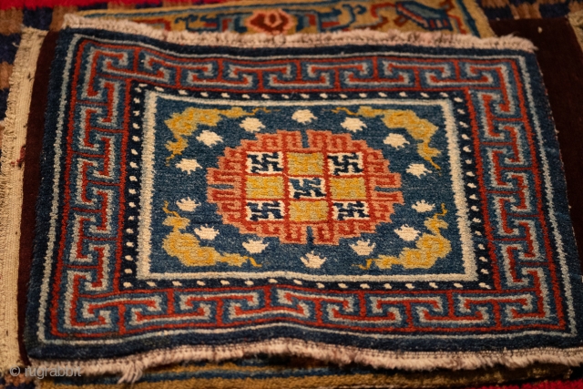 Tibetan Khagangma Meditation Rug - Tibet, 19th c, blue field with medallion and  "frog foot" motif.  70x54 cm             