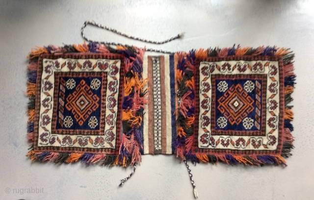 Persian double saddlebag Khorjin 

34.5 in (88 cm) x 15 in (37.5 cm). 20th century, possibly 1920s.

Intact.  In good condition.  Decorative fringes with some fading, presumably some aniline dye.

Contact:   ...