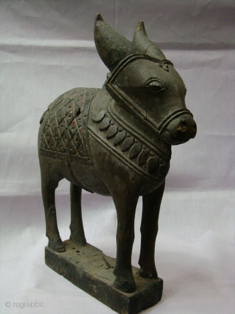   Wooden Nandi(Bull) Toy.

  A Nandi for childrens from Central Maharashtra (Central India).

 A Nandi use as a Toy for Special yearly festival of Maharashtra name as ( Pola festival).  ...