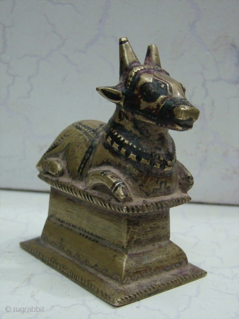 Brass Nandi Statue The 'vahana' or carrier of Shiva, 
The Nandi Bull is always to be found facing the 'shivalingam' in places of worship. Nandi represents the creative energies of the restless  ...