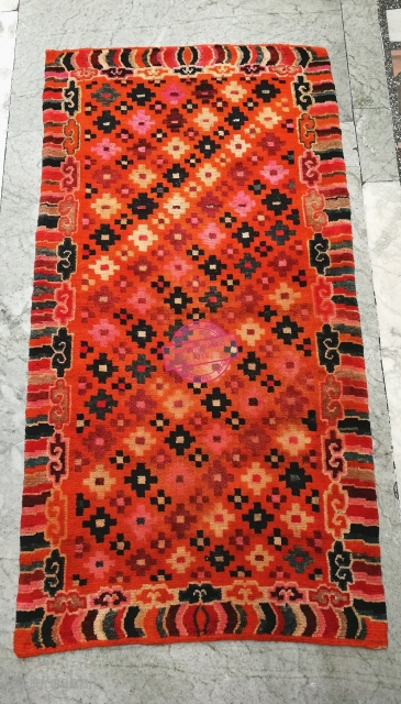 Beautiful Tibetan Khaden in very Good condition. In the center it features , Tigma design surrounded by cloud/wave border, with multi color.

19th century.
More image on request.       