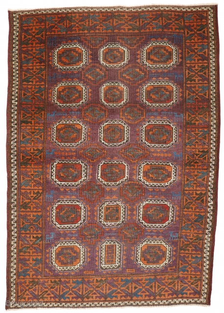 # 1127 Rare symmetrically knotted rug, "Baluch Tradition", with Turkmen guls, 109/156 cm, Khorasan (?), late 19th century, unusual palette of secondary colours (Orange, Aubergine, Green), all of natural origin, contrasted by  ...