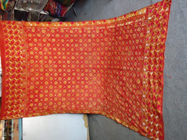 This red color embroidered shawl from Nangarparkar, Sindh, Pakistan near to Kutch, India. It is 70-80 years old. Hand embroidered with natural shining silky threads. These shawls are now rarely available. It  ...