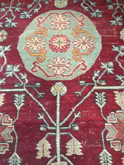 Pair of Khotan fragments, each 32" x 35", cut from a large early 19th c 3 medallion Tarim Basin carpet.
Condition good for age with areas of thinning. well saturated, compelling shale green  ...