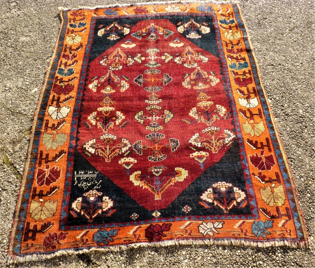 Persian Gabbeh. Dated. Size: 137 x 176 cm. Some low pile. Used.                     