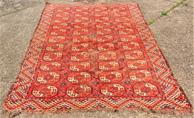 antique Ersari Maincarpet Turkoman rug. Size: 187 x 261 cm. Used condition. Holes. Collectors item. Very interesting piece.               