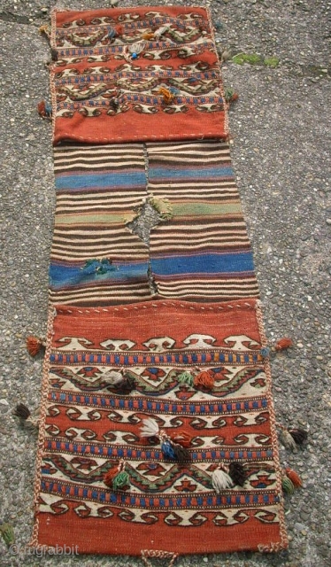 Very old anatolian Heybe. 43 x 144 cm. Used. In the middle holes and repairs.                  