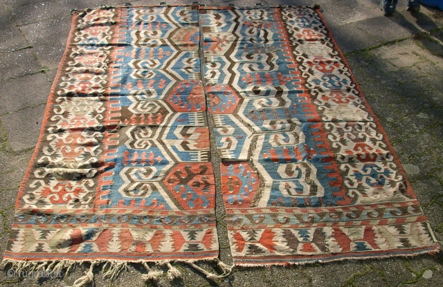 Antique anatolien Kelim! Size: 209 x 155 cm (Both). Used. Holes and repairs. 
I think it was used as a curtain.            