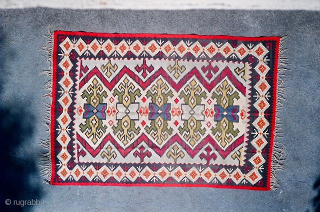 
Antique Pirot sarkoy kilim named Sluzavnik. 
Age: very begining of 20th century. 
Dimensions:about 200x150, very unique ornament...                