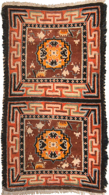 Two seating squares that have almost certainly come from a much longer Tibetan ‘runner’ (a long narrow carpet). Made sometime in the early 1900’s, the size is 135cm x 74cm (approximately 53in  ...