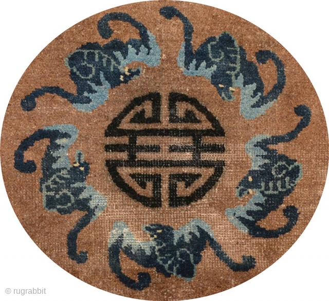 Small circular auspiciously designed rug from the Baotou / Suiyuan region of Inner Mongolia, with the central Shou symbol - the Chinese symbol of longevity - surrounded by a circle of five  ...