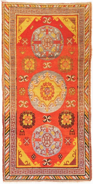 Striking East Turkestan three medallion carpet, probably from either Khotan or Yarkand, which are both ancient oasis towns on the southern branch of the Silk Road in what is today Xinjiang, the  ...