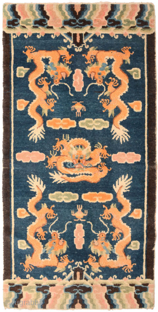 From the Ningxia region of China comes this five dragon carpet with a center field of naturally dyed lightly abrashed blue that was made in the 2nd half of the 1800’s /  ...