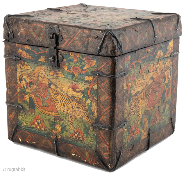 This small Tibetan chest is made of wood with leather trim fastened by metal tabs and painted on three of the side panels with a lifelike illustration known as “Mongol Leading A  ...